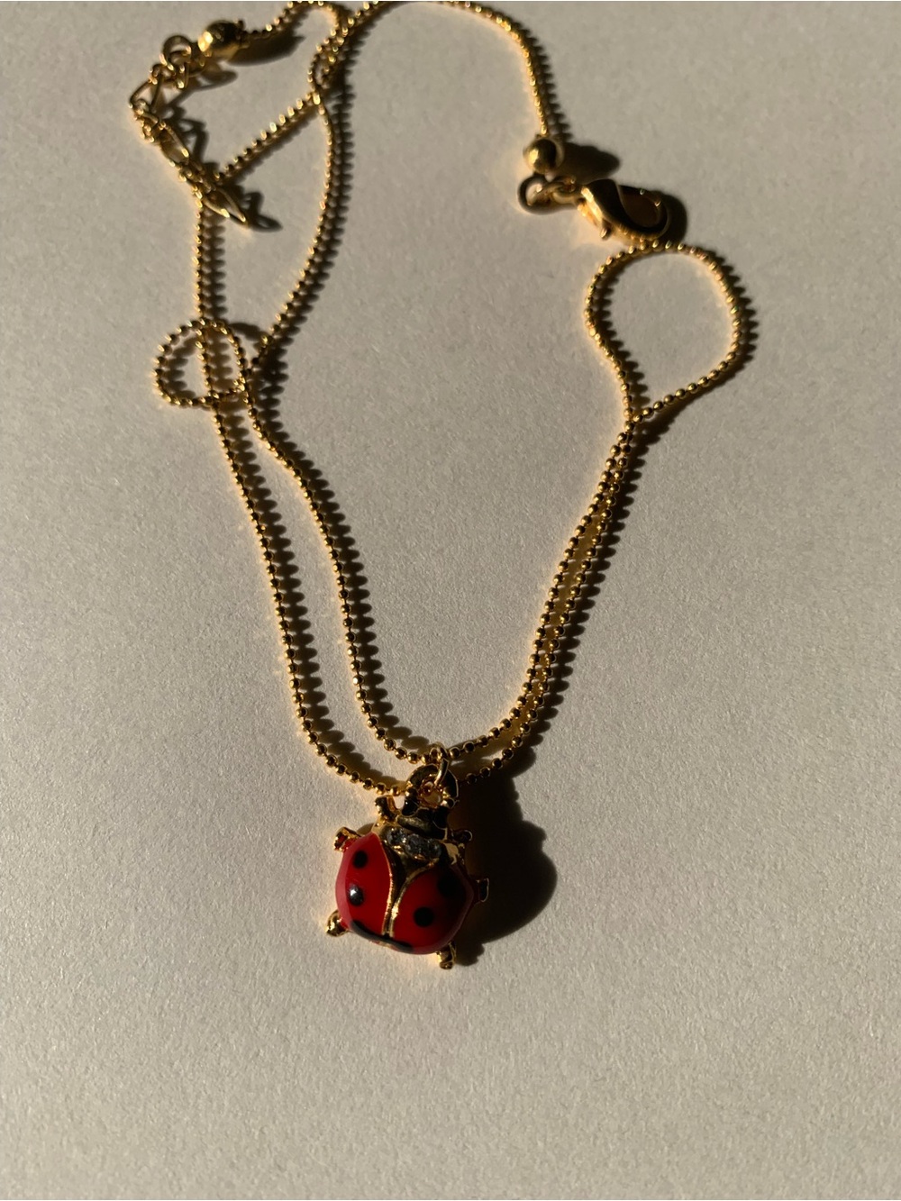 Gold-Tone Ladybug Pendant Necklace in Red and Black